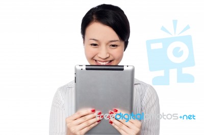 Shy Pretty Corporate Lady Holding Tablet Device Stock Photo