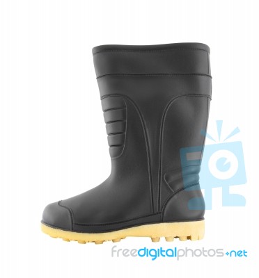 Side Of Rubber Black Boot Shoe On White Background Stock Photo