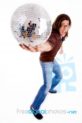 Side Pose Of Male Showing Disco Ball Stock Photo