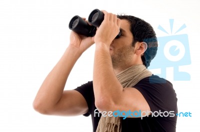 Side Pose Of Man Looking Through Binocular Stock Photo