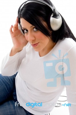 Side Pose Of Model With Headphone On White Background Stock Photo