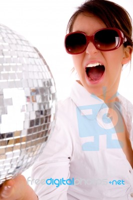 Side Pose Of Shouting Woman Holding Disco Ball Stock Photo