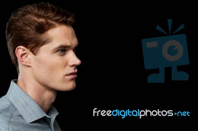 Side Pose Of Stylish Young Man Stock Photo