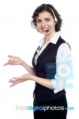 Side Profile Of A Beautiful Customer Support Executive Stock Photo