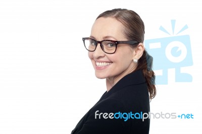 Side Profile Of A Woman Wearing Spectacles Stock Photo