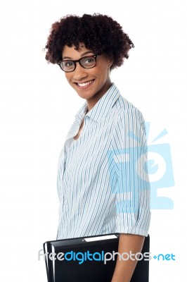 Side Profile Of Casual Business Lady Holding Files Stock Photo