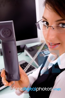 Side View Of Businesswoman Holding Phone Receiver Stock Photo