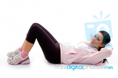 Side View Of Exercising Female On White Background Stock Photo