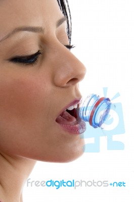 Side View Of Female Drinking Water Stock Photo