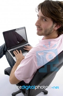 Side View Of Man With Laptop Stock Photo