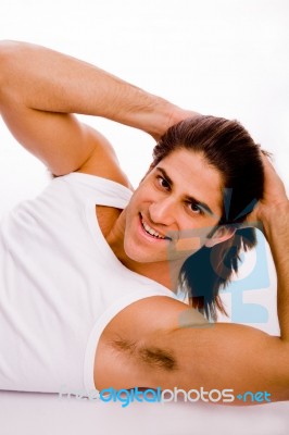 Side View Of Smiling Exercising Male Stock Photo