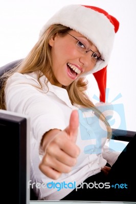 Side View Of Smiling Manager With Christmas Hat Showing Thumb Up… Stock Photo