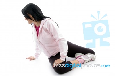 Side View Of Woman Doing Exercise On White Background Stock Photo