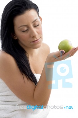 Side View Of Woman Posing With Apple Stock Photo