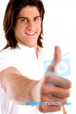 Side View Of Young Model With Thumbsup Stock Photo