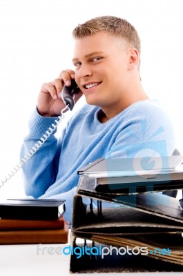 Side View Of Young Professional Talking On Phone Stock Photo