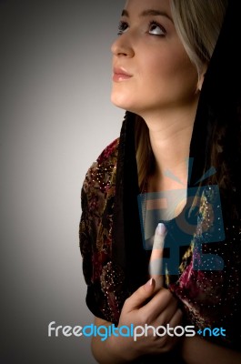 Side View Of Young Woman With Stole Looking Up Stock Photo