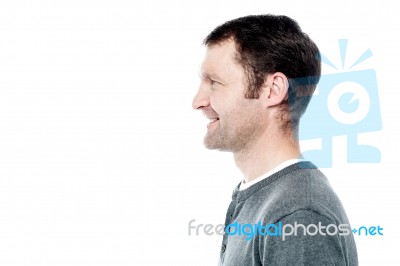 Side View Portrait Of Smiling Man Stock Photo