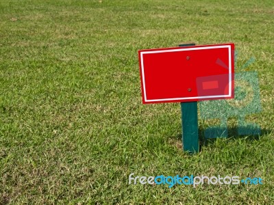 Sign On Grass Stock Photo