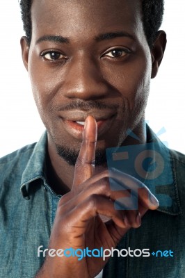 Silence Gesture By A Young Guy, Closeup View Stock Photo