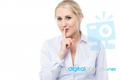 Silence Gesture By Young Corporate Lady Stock Photo