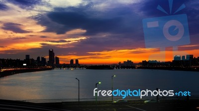 Silhouette Cityscape At Han River And Beautiful Sunset In Seoul, South Korea.(dark Tone) Stock Photo