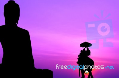 Silhouette Elephant With Tourist In Front Of Big Buddha At Sunse… Stock Photo