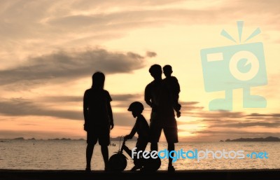 Silhouette Family At Beach Stock Photo