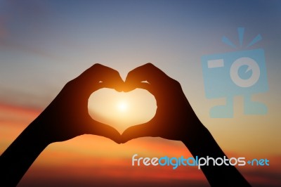 Silhouette Hand Gesture Feeling Love During Sunset Stock Photo