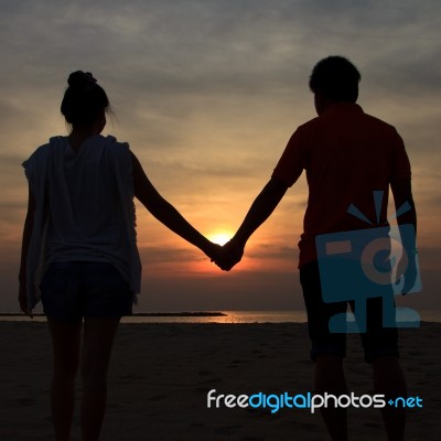 Silhouette In Sunset Stock Photo