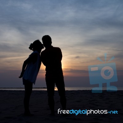 Silhouette In Sunset Stock Photo