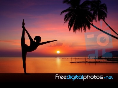 Silhouette Of Yoga Girl at Sunset Stock Image