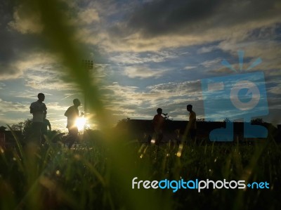 Silhouette  Running On Road At Sunrise Stock Photo