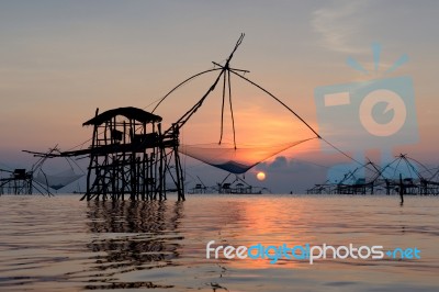 Silhouette Square Dip Net With Sunrise Background In Patthalung,… Stock Photo