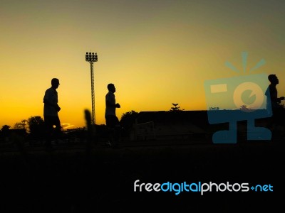 Silhouette Teen Age Run Together  Track Stock Photo