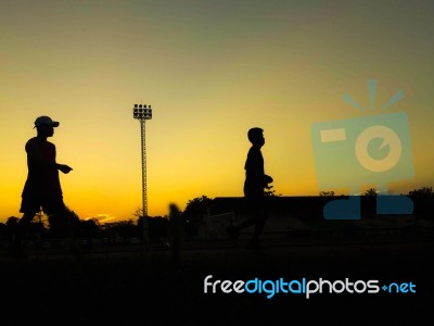 Silhouette Teen Age Run Together  Track Stock Photo