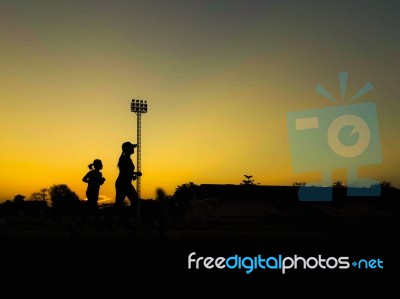 Silhouette Teen Age Run Together  Track Stock Photo