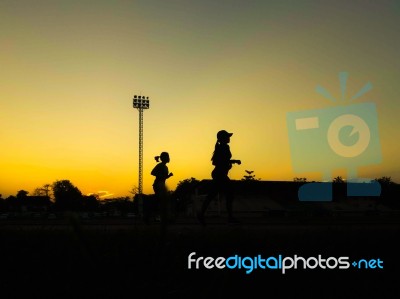 Silhouette Teen Age Run Together  Track Stock Photo