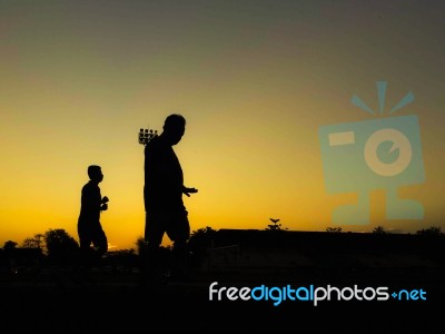 Silhouette Teen Age Run Together  Track Stock Photo