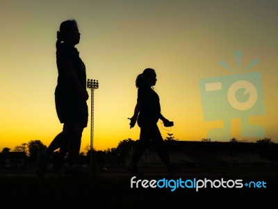 Silhouette Teen Age Run Together  Track Stock Photo