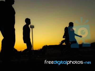 Silhouette Teen Age Run Together  Track Stock Photo