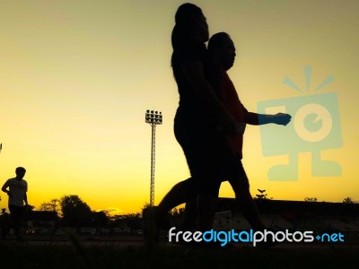 Silhouette Teen Age Run Together  Track Stock Photo