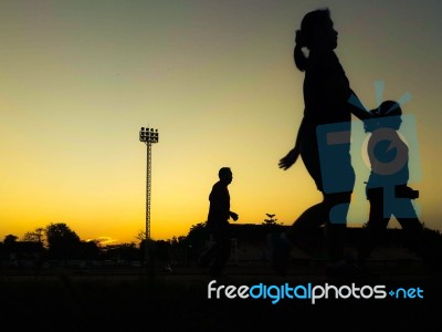 Silhouette Teen Age Run Together  Track Stock Photo