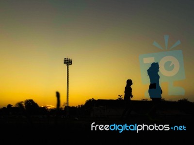 Silhouette Teen Age Run Together  Track Stock Photo