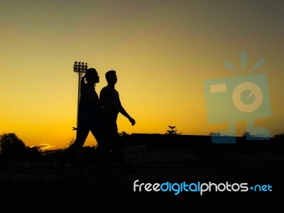 Silhouette Teen Age Run Together  Track Stock Photo