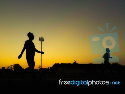 Silhouette Teen Age Run Together  Track Stock Photo