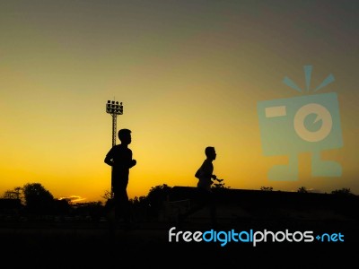 Silhouette Teen Age Run Together  Track Stock Photo