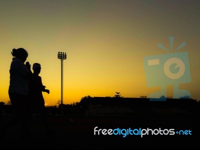 Silhouette Teen Age Run Together  Track Stock Photo