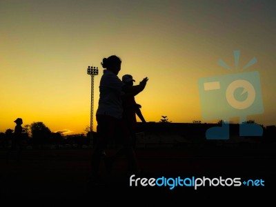 Silhouette Teen Age Run Together  Track Stock Photo