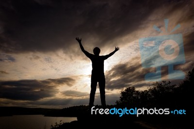 Silhouette Tourist Man Open Arm. He Is Happy In The Mountain. To… Stock Photo